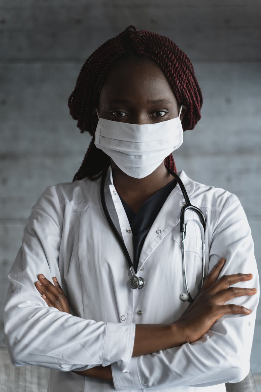 photo of woman with stethoscope hanging on the back of her neck